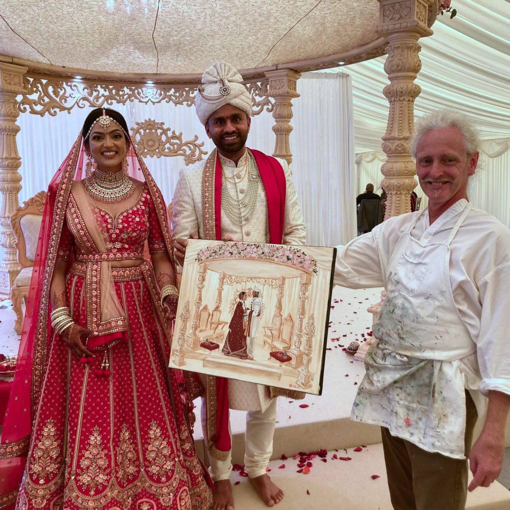 Professional live wedding painter creating beautiful artwork at wedding ceremony - UK wedding artist services