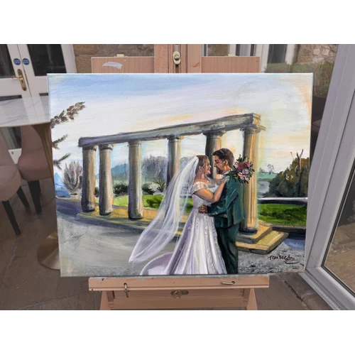 A bride and groom hold each other in front of a beautiful stone monument. Laura and Reece, Coniston Estate, March 2026.